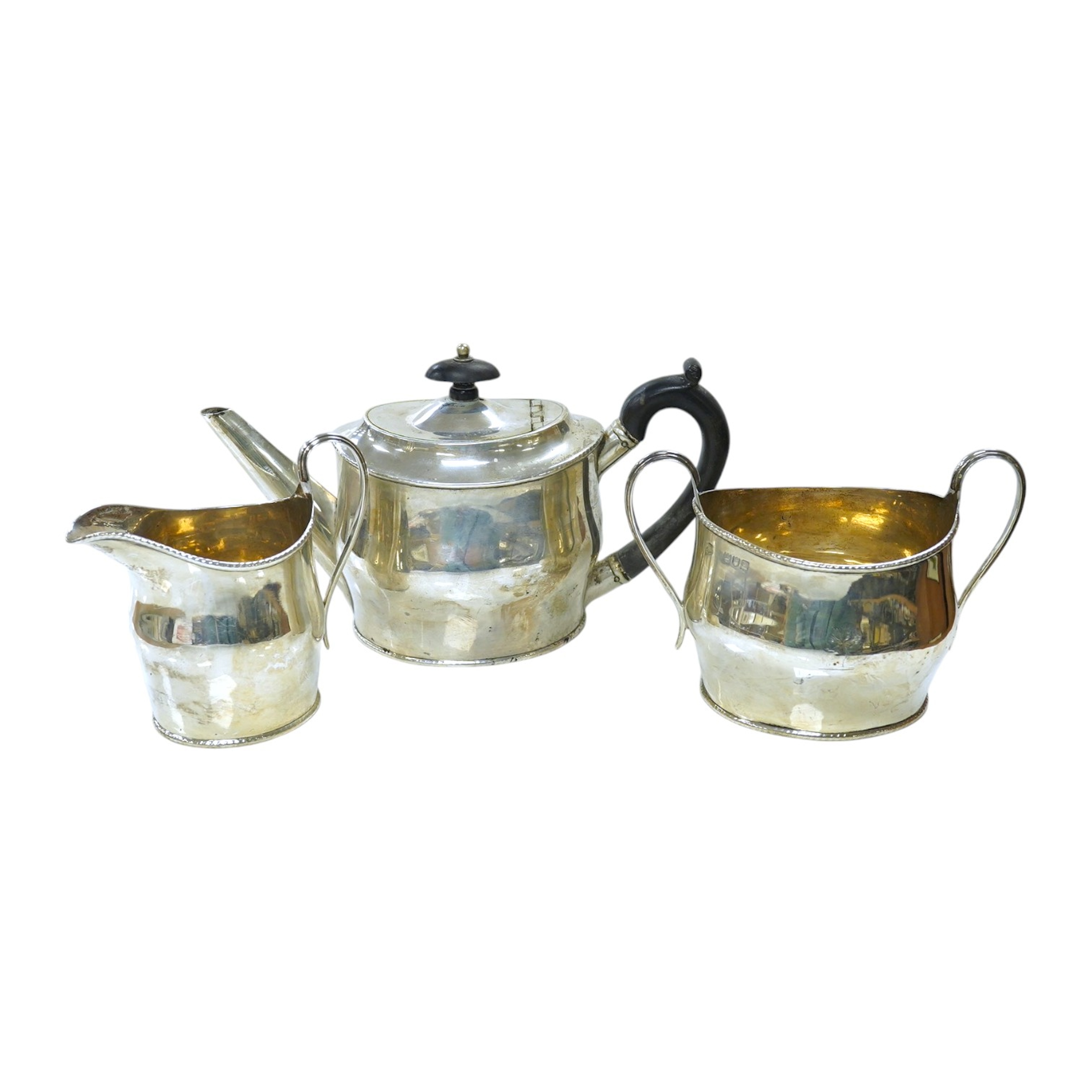 A late Victorian three piece silver teaset of oval form, London 1896, gross 21oz. Good condition.